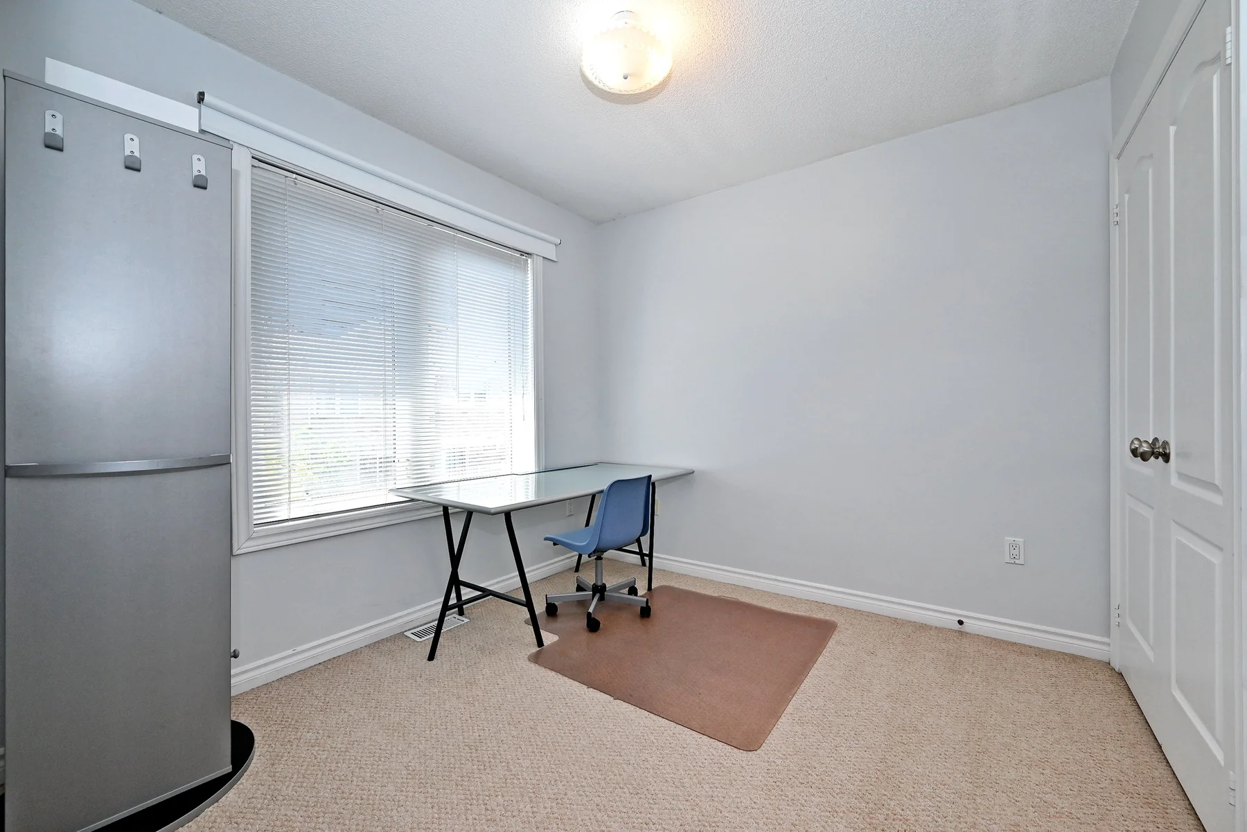 Third bedroom shown as a workspace